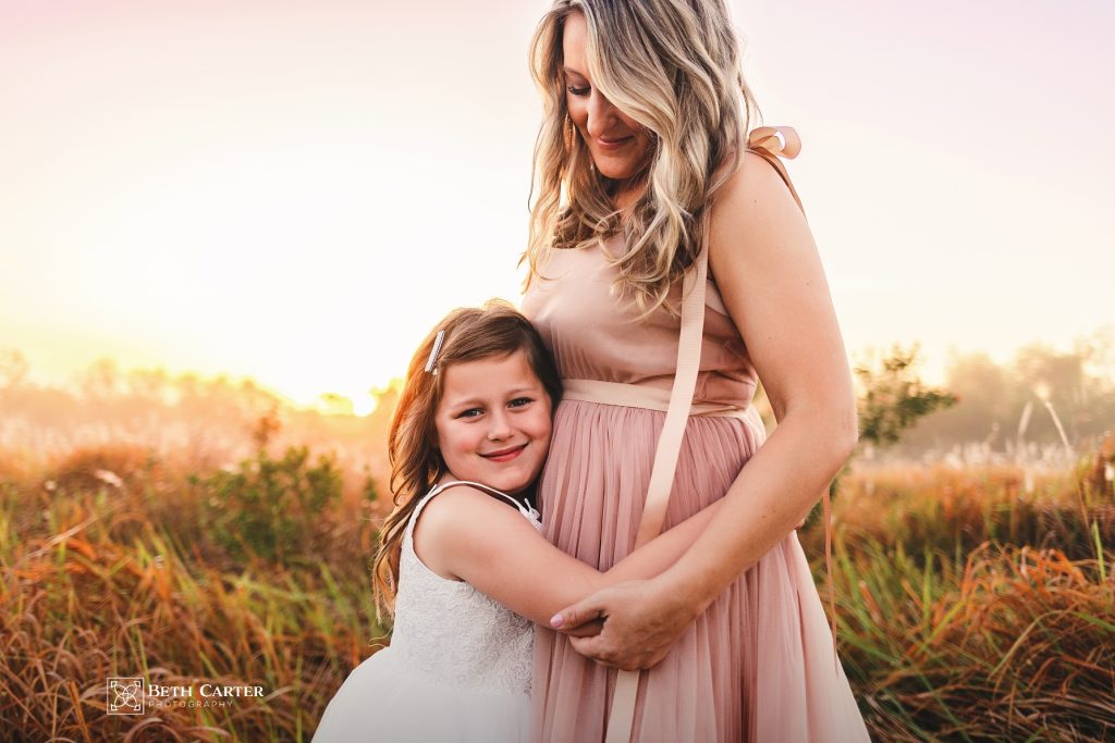 sunrise session of a mom and her daughter in beautiful gowns