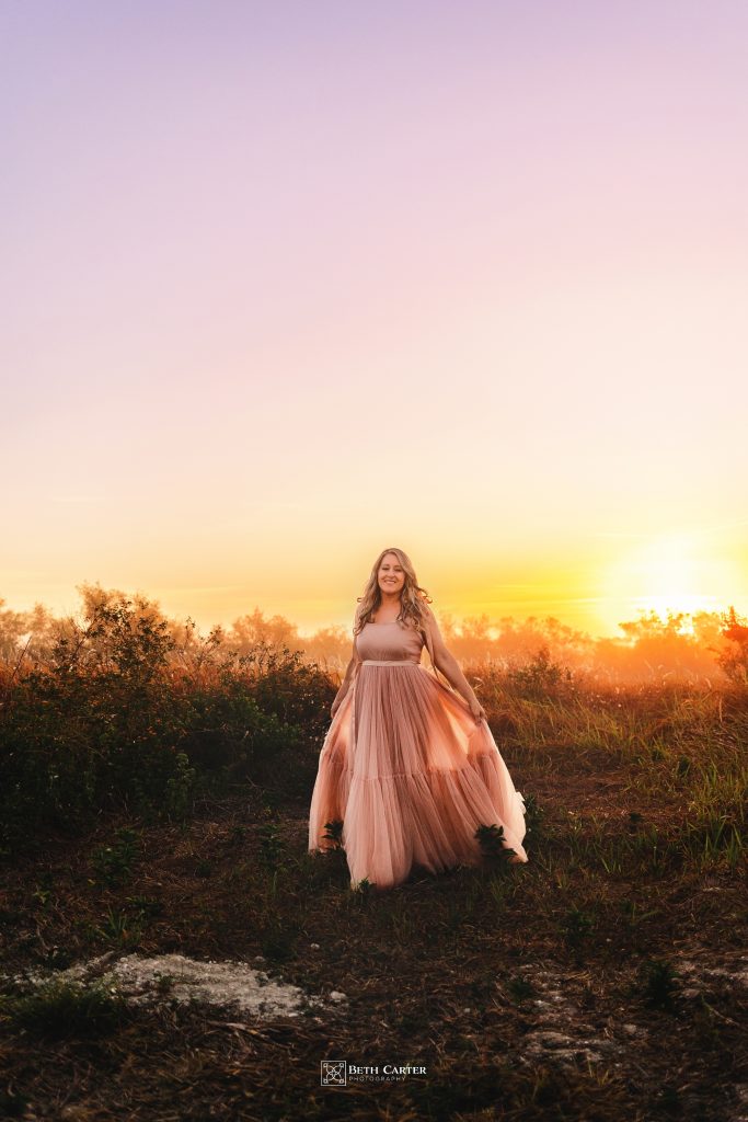 sunrise session of a mom and her daughter in beautiful gowns