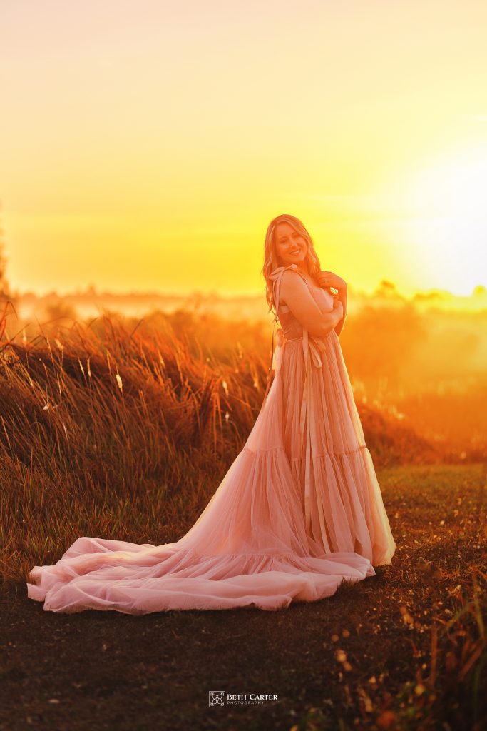 sunrise session of a mom and her daughter in beautiful gowns