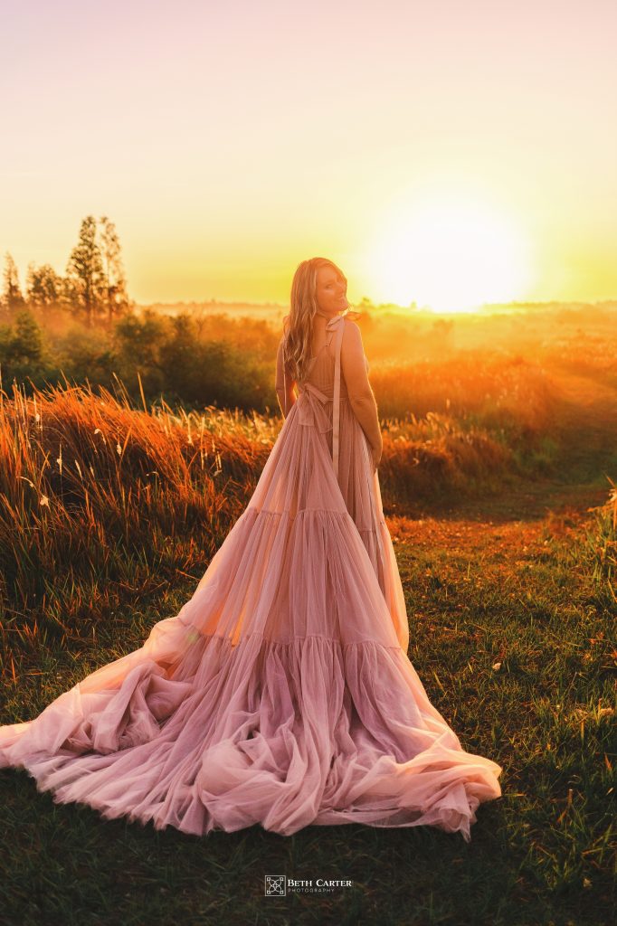 sunrise session of a mom and her daughter in beautiful gowns