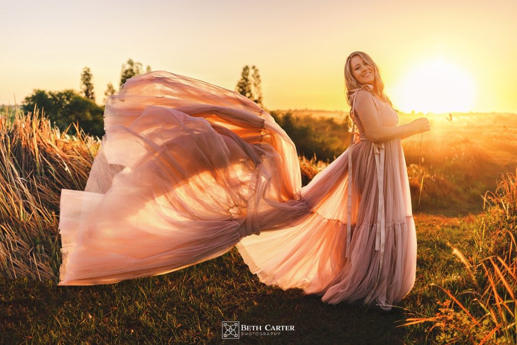 sunrise session of a mom and her daughter in beautiful gowns