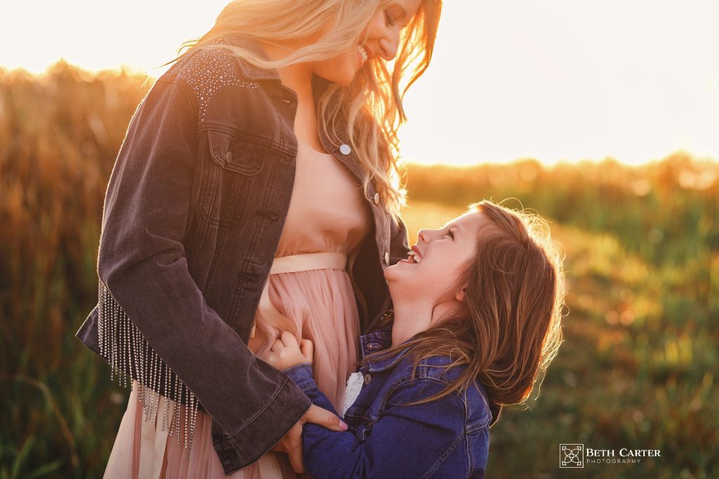 sunrise session of a mom and her daughter in beautiful gowns