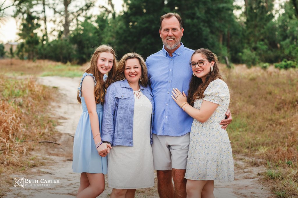 photo of family dressed for spring in a rustic setting in Bartow, FL