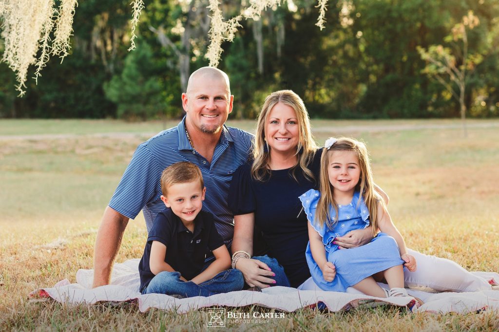 family photo taken in the grass in Bartow FL